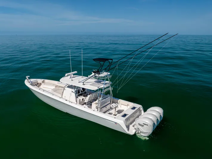 Double Bird Yacht Photos Pics 2020 Contender 44 ST boat on calm ocean waters, equipped with multiple outboard engines.