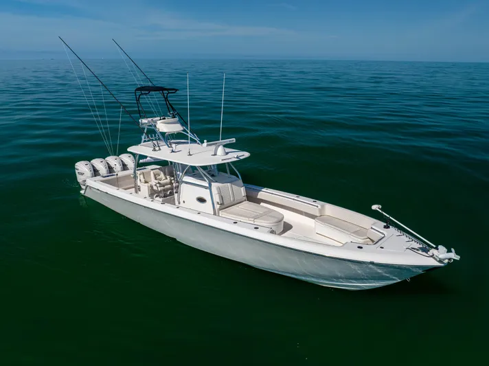 Double Bird Yacht Photos Pics 2020 Contender 44 ST boat on calm ocean waters, featuring multiple outboard engines.