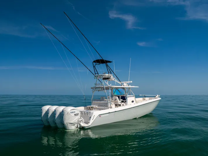 Double Bird Yacht Photos Pics 2020 Contender 44 ST boat with four engines on calm ocean waters.