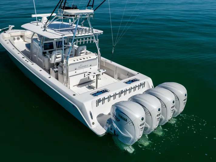 Double Bird Yacht Photos Pics 2020 Contender 44 ST boat with four powerful outboard engines on calm water.