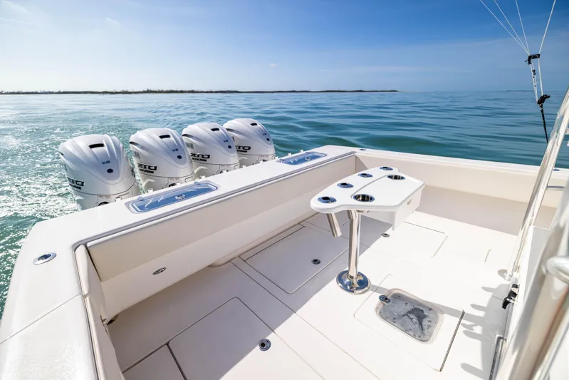 Double Bird Yacht Photos Pics 2020 Contender 44 ST boat with quad engines on calm ocean waters.