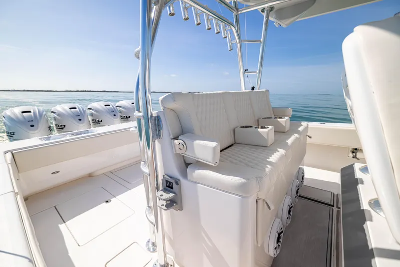 Double Bird Yacht Photos Pics 2020 Contender 44 ST boat interior with seating and multiple outboard engines.