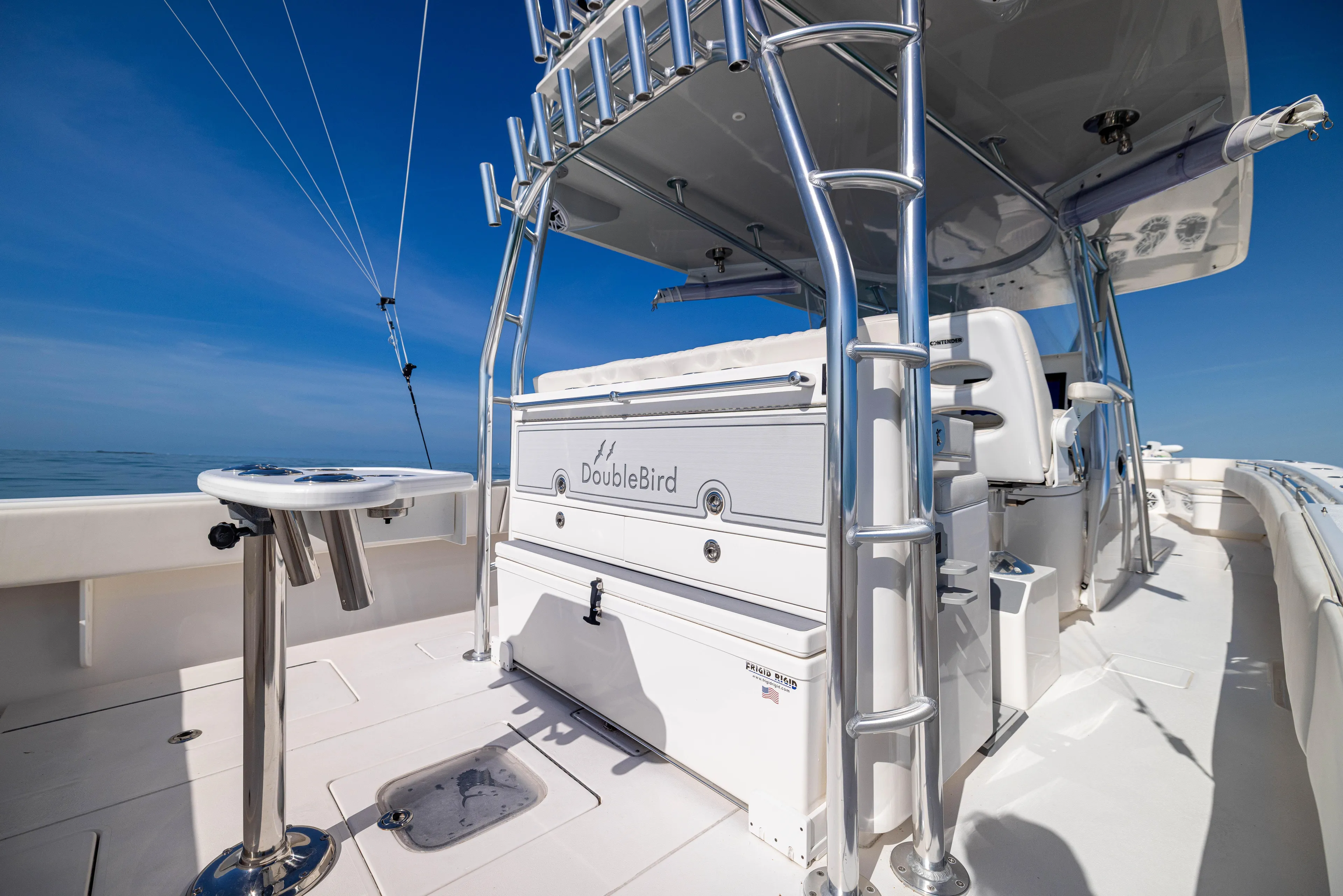 Double Bird Yacht Photos Pics 2020 Contender 44 ST boat deck with fishing equipment and seating.