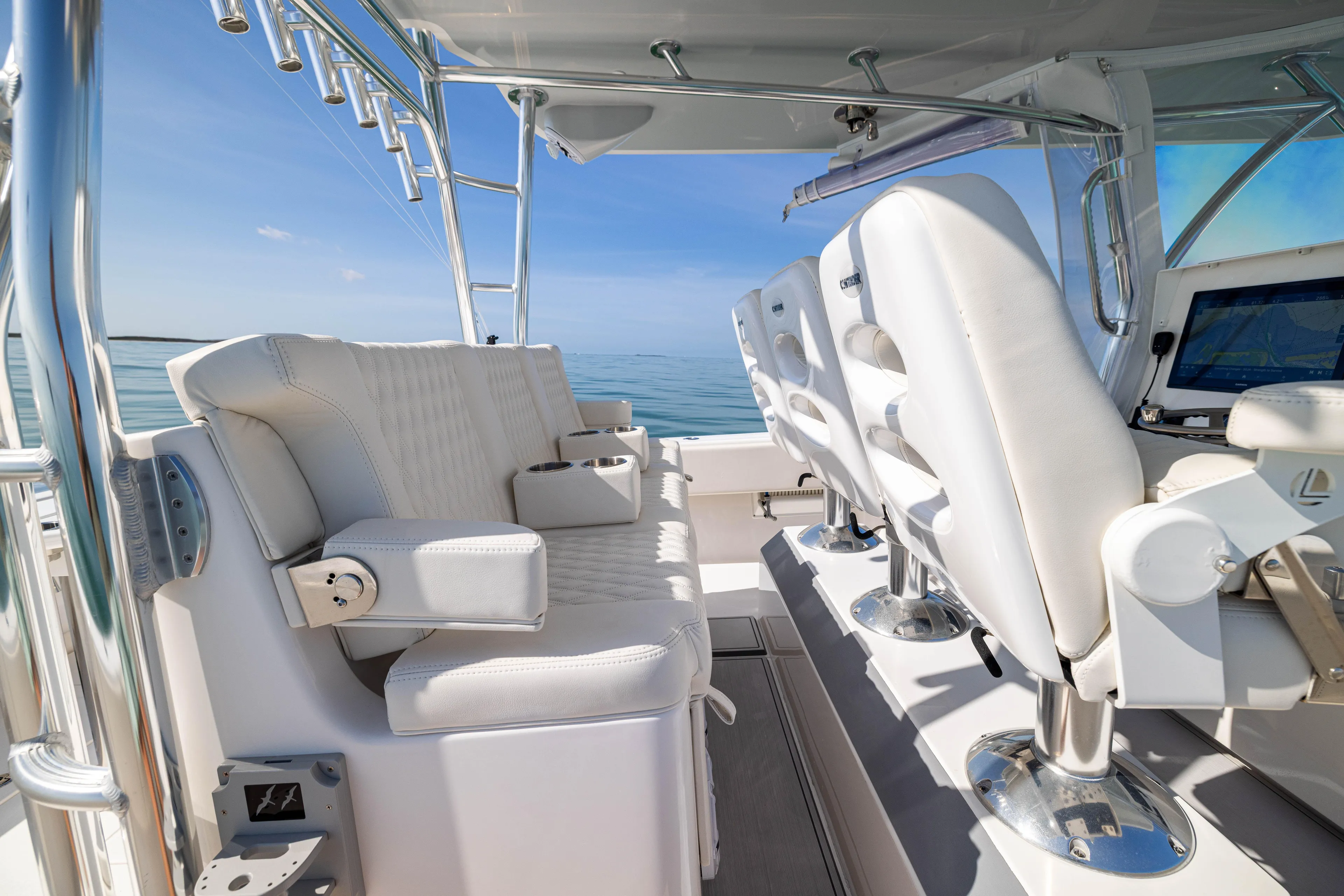 Double Bird Yacht Photos Pics 2020 Contender 44 ST boat interior with white seating and ocean view.