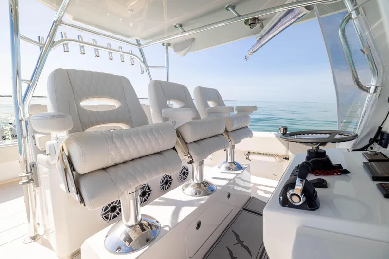 Double Bird Yacht Photos Pics Luxurious interior of a 2020 Contender 44 ST boat with plush seating and ocean view.