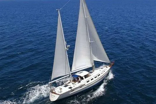 Pacific High Yacht Photos Pics 1983 Stuart Marine 62 Custom Ketch sailing on open sea, showcasing elegant design.