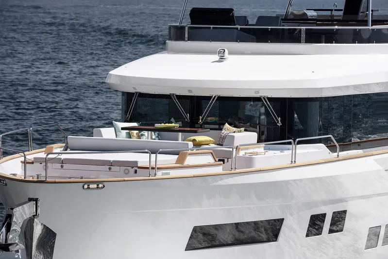  Yacht Photos Pics Luxurious 2027 Sirena 68 yacht with elegant deck seating on the ocean.