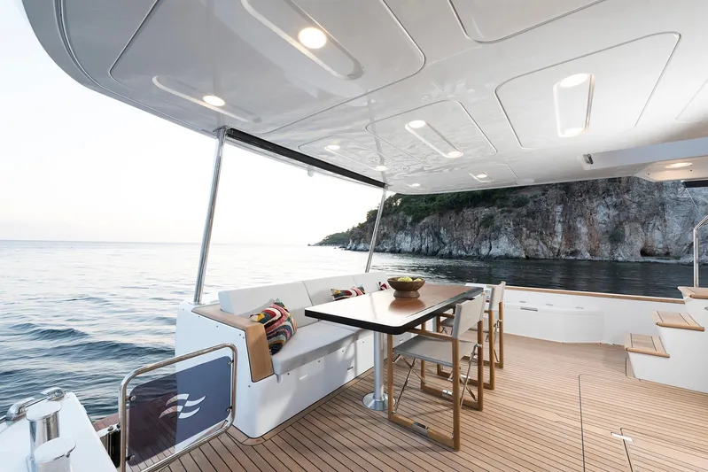  Yacht Photos Pics Luxurious Sirena 68 yacht deck with dining area, ocean view, and modern design, 2027 model.