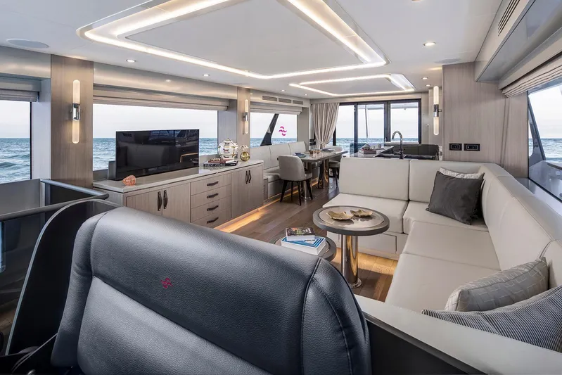  Yacht Photos Pics Luxurious interior of 2027 Sirena 68 yacht with modern furnishings and ocean view.