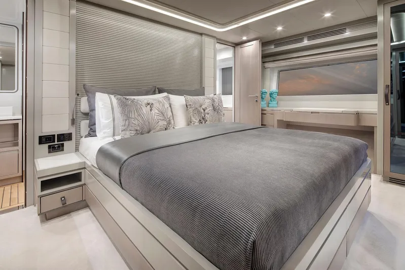  Yacht Photos Pics Luxurious bedroom interior of 2027 Sirena 68 yacht with modern design and elegant decor.