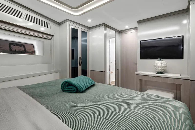  Yacht Photos Pics Luxurious 2027 Sirena 68 yacht bedroom with modern decor and elegant furnishings.