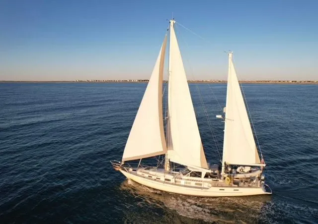 Pacific High Yacht Photos Pics 1983 Stuart Marine 62 Custom Ketch sailing on open water under clear skies.