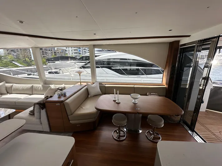 Yacht Photos Pics Luxurious interior of 2022 Princess Y72 yacht with elegant seating and dining area.