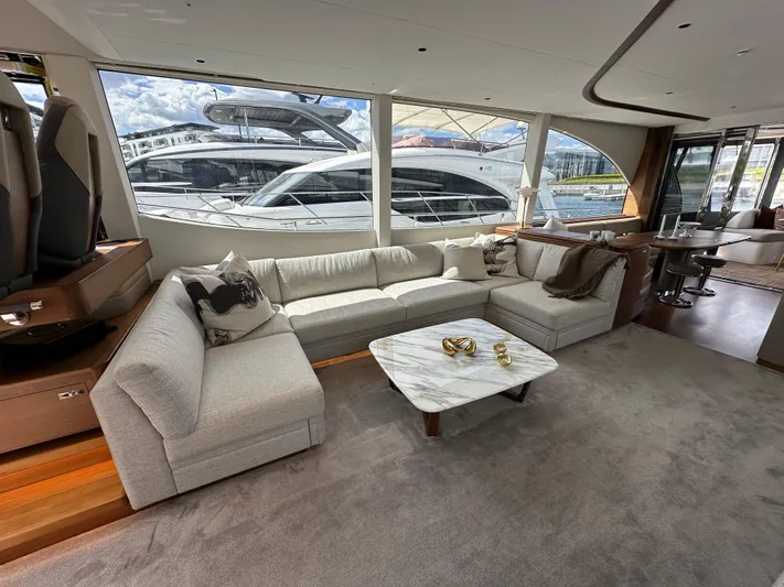  Yacht Photos Pics Luxurious interior of 2022 Princess Y72 yacht with elegant seating and large windows.