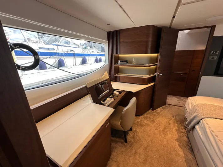  Yacht Photos Pics Luxurious interior of 2022 Princess Y72 yacht with elegant wood finishes and modern design.