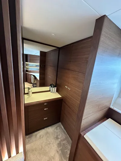  Yacht Photos Pics Luxurious interior of 2022 Princess Y72 yacht with elegant wood finishes and modern design.