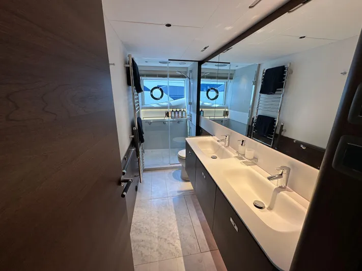  Yacht Photos Pics Luxurious bathroom on 2022 Princess Y72 yacht with dual sinks and modern fixtures.