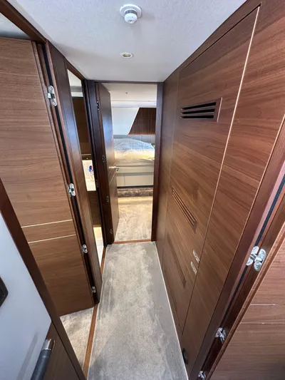  Yacht Photos Pics Luxurious hallway inside 2022 Princess Y72 yacht with wooden paneling.