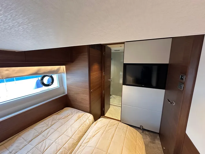  Yacht Photos Pics Luxurious cabin interior of 2022 Princess Y72 yacht with twin beds and modern amenities.