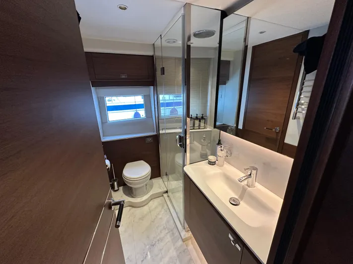  Yacht Photos Pics Luxurious bathroom in 2022 Princess Y72 yacht with modern fixtures and elegant design.