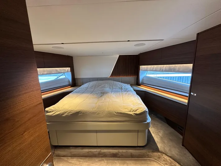  Yacht Photos Pics Luxurious bedroom interior of 2022 Princess Y72 yacht with modern design and large windows.
