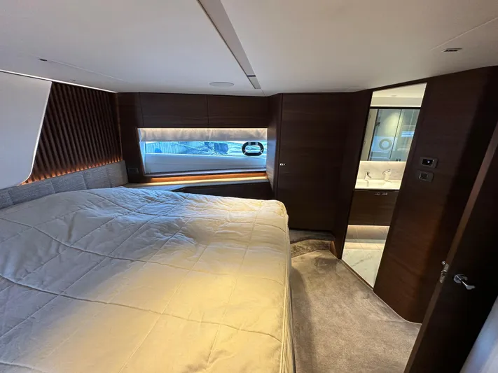  Yacht Photos Pics Luxurious bedroom interior of 2022 Princess Y72 yacht with modern design and elegant furnishings.