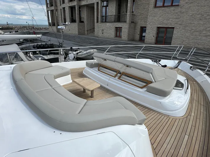  Yacht Photos Pics Luxurious 2022 Princess Y72 yacht deck with elegant seating and wooden accents.