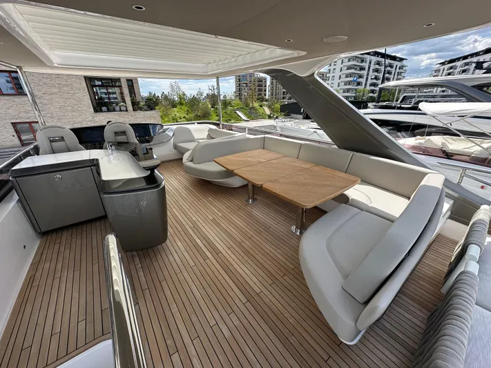  Yacht Photos Pics Luxurious 2022 Princess Y72 yacht deck with elegant seating and dining area.