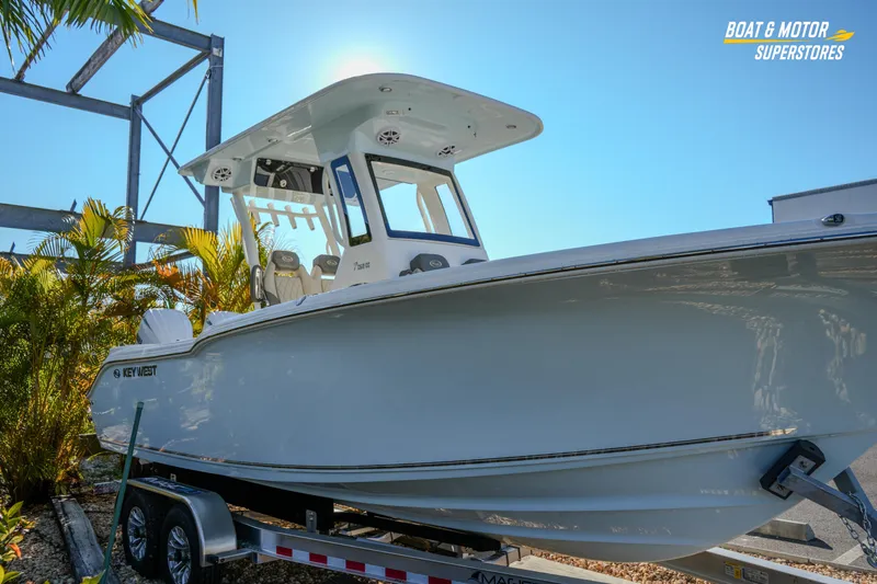  Yacht Photos Pics 2026 Key West 260 Center Console boat on trailer, sunny day, palm trees in background.