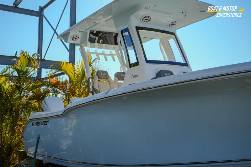  Yacht Photos Pics 2026 Key West 260 Center Console boat displayed outdoors with tropical plants.