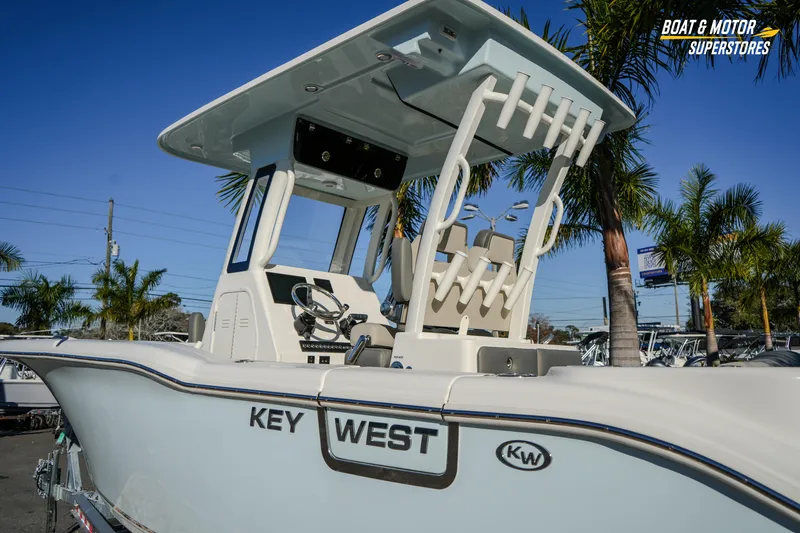  Yacht Photos Pics 2026 Key West 260 Center Console boat with T-top, displayed outdoors near palm trees.