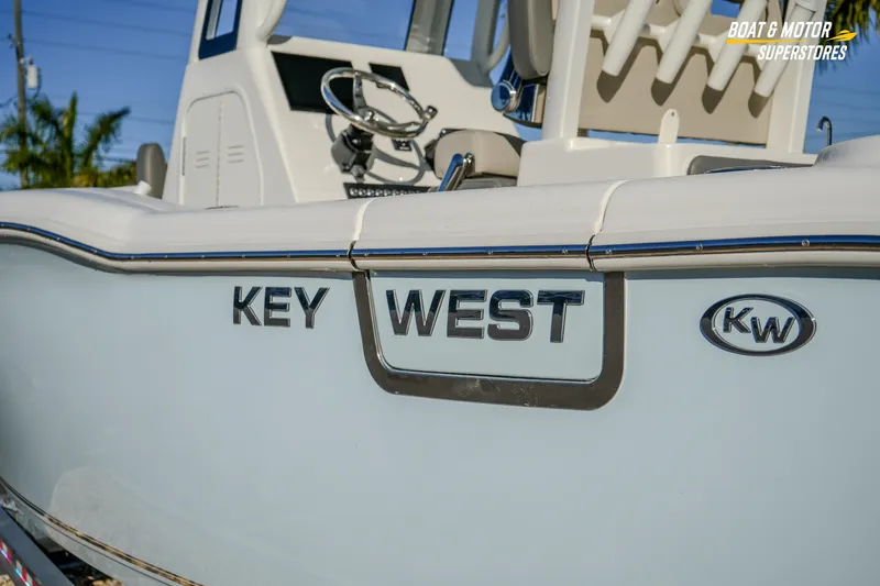  Yacht Photos Pics 2026 Key West 260 Center Console boat, side view with logo and steering wheel visible.