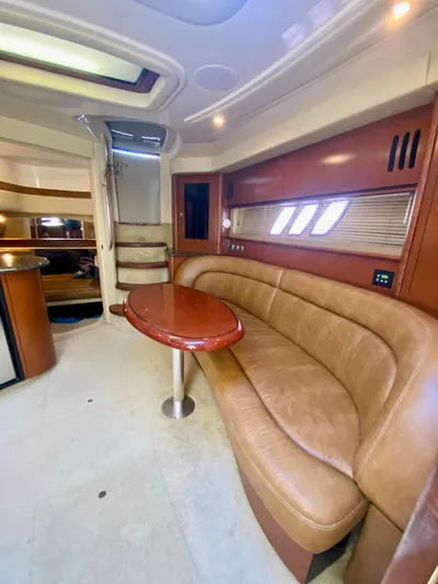  Yacht Photos Pics Interior of 2007 Sea Ray 44 Sundancer yacht with leather seating and wooden table.