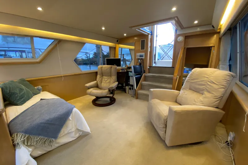 Irish Hurricane Yacht Photos Pics Interior of 1998 Carver 445 Aft Cabin Motor Yacht with cozy seating and modern decor.