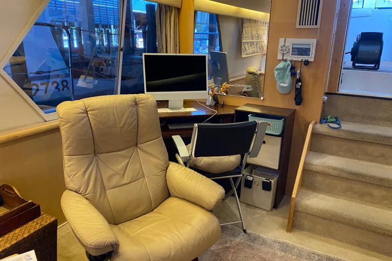 Irish Hurricane Yacht Photos Pics Interior of 1998 Carver 445 Aft Cabin Motor Yacht with office setup and seating.