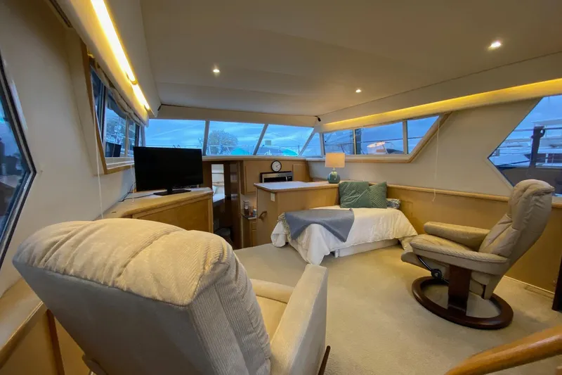 Irish Hurricane Yacht Photos Pics Luxurious interior of 1998 Carver 445 Aft Cabin Motor Yacht with cozy seating and bed.