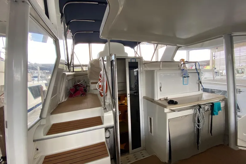 Irish Hurricane Yacht Photos Pics 1998 Carver 445 Aft Cabin Motor Yacht interior with stairs and kitchenette.