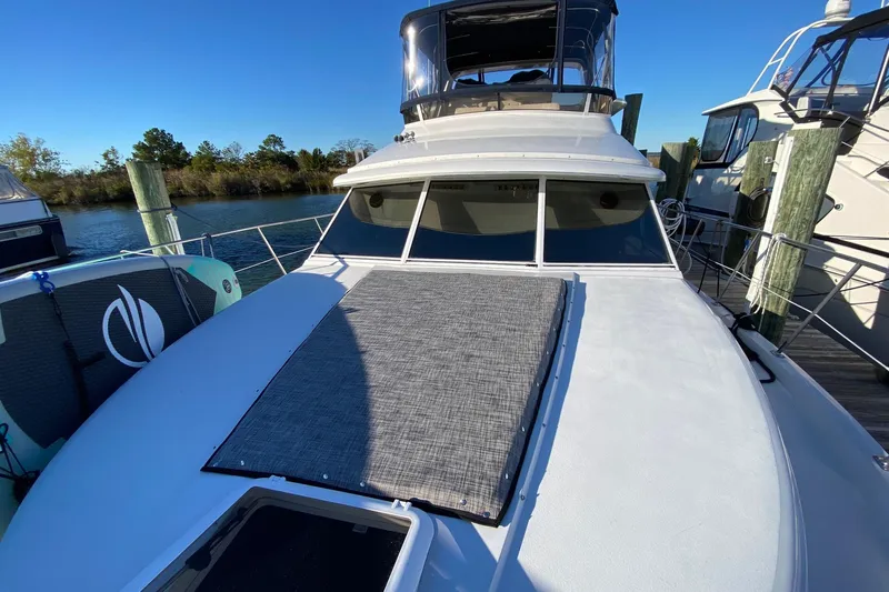 Irish Hurricane Yacht Photos Pics 1998 Carver 445 Aft Cabin Motor Yacht docked, featuring spacious deck and sleek design.