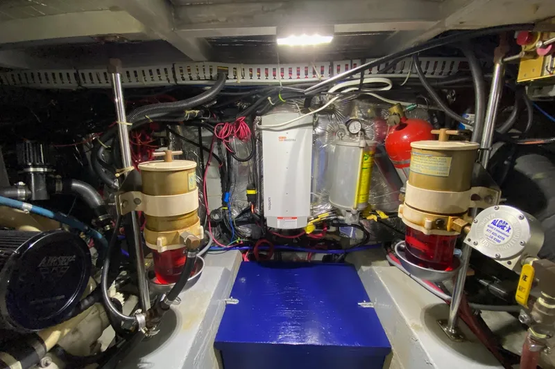 Irish Hurricane Yacht Photos Pics Engine room of 1998 Carver 445 Aft Cabin Motor Yacht, showcasing mechanical components.