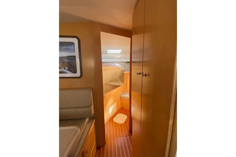 Irish Hurricane Yacht Photos Pics Interior of 1998 Carver 445 Aft Cabin Motor Yacht, featuring wood paneling and cozy seating.