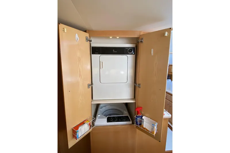 Irish Hurricane Yacht Photos Pics Laundry area inside 1998 Carver 445 Aft Cabin Motor Yacht with washer and dryer.