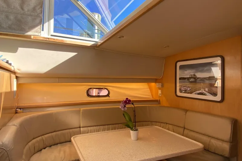 Irish Hurricane Yacht Photos Pics Interior of 1998 Carver 445 Aft Cabin Motor Yacht with seating and table.