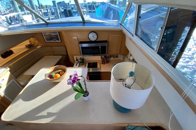 Irish Hurricane Yacht Photos Pics Interior of 1998 Carver 445 Aft Cabin Motor Yacht with kitchen and seating area.