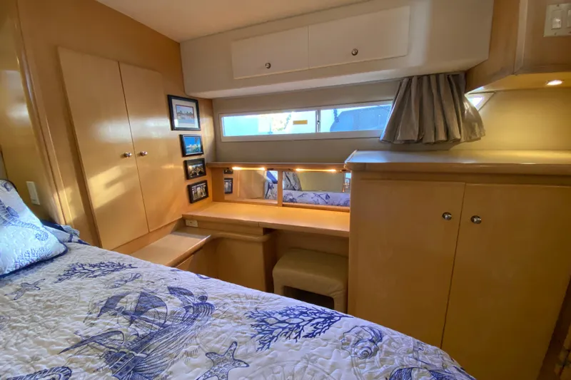 Irish Hurricane Yacht Photos Pics 1998 Carver 445 Aft Cabin Motor Yacht interior with cozy bedroom and nautical decor.