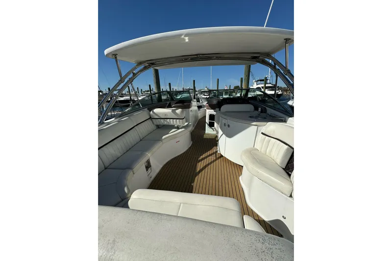  Yacht Photos Pics Luxurious 2013 Cobalt 336 boat interior with white seating and wooden flooring.