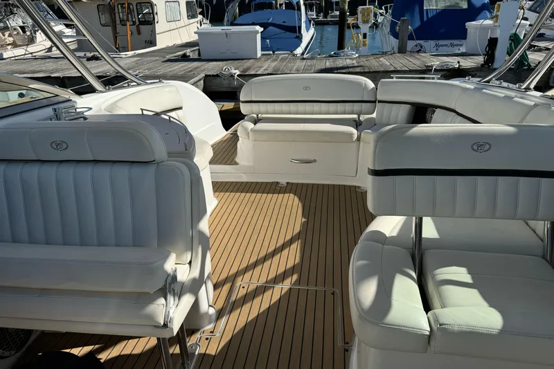 Yacht Photos Pics Luxurious interior of a 2013 Cobalt 336 boat with white seating and wooden flooring.