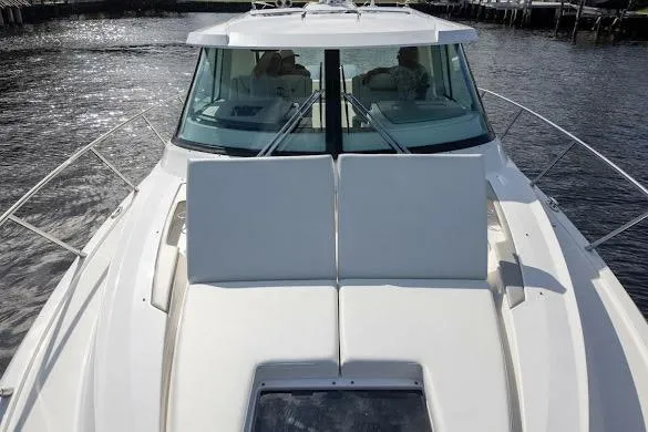  Yacht Photos Pics 2022 Tiara Sport 43 LE boat on water, showcasing sleek design and spacious deck.