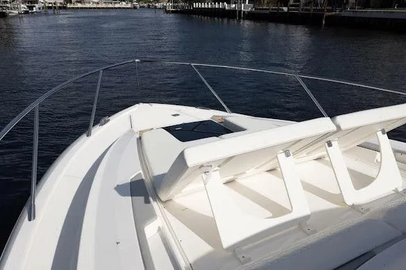  Yacht Photos Pics 2022 Tiara Sport 43 LE boat deck with seating, overlooking calm waters.