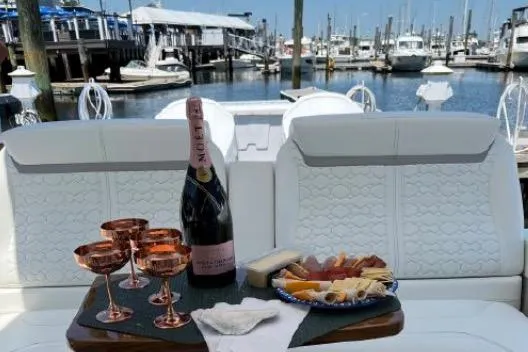  Yacht Photos Pics Luxury yacht Tiara Sport 43 LE 2022 with champagne and charcuterie at marina.