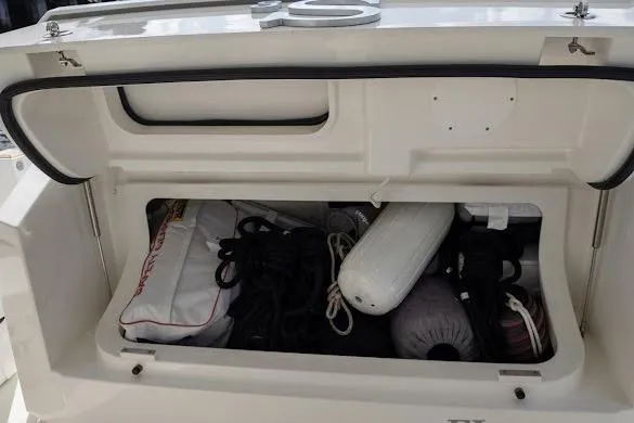  Yacht Photos Pics Storage compartment of 2022 Tiara Sport 43 LE boat with ropes and fenders.